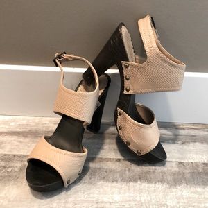 Nude high heel sandals.
